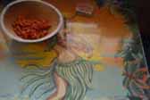 Detail photo of Hula Girl artwook on dining table in 1949 Star Trailer